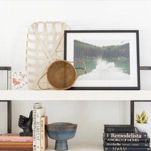 white open shelves with baskets books and pictures